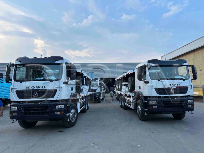 10 yksikköä Howo TX -aita -kuorma -auto, jossa lasti vetopalkin perävaunu, joka on onnistuneesti lähetetty Etiopiaan
